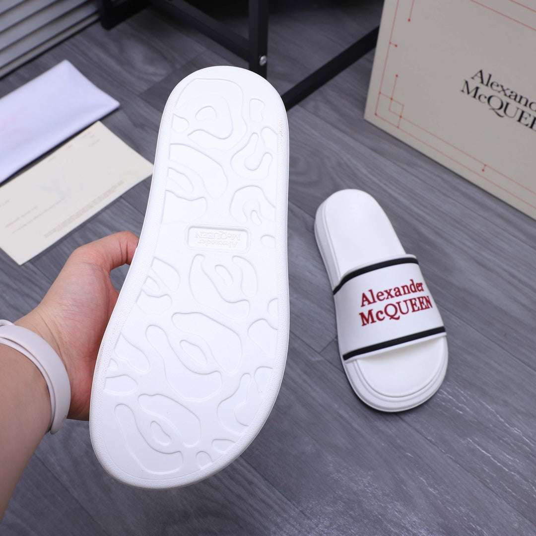 White slide sandal outsole with embossed design, shown beside matching slides