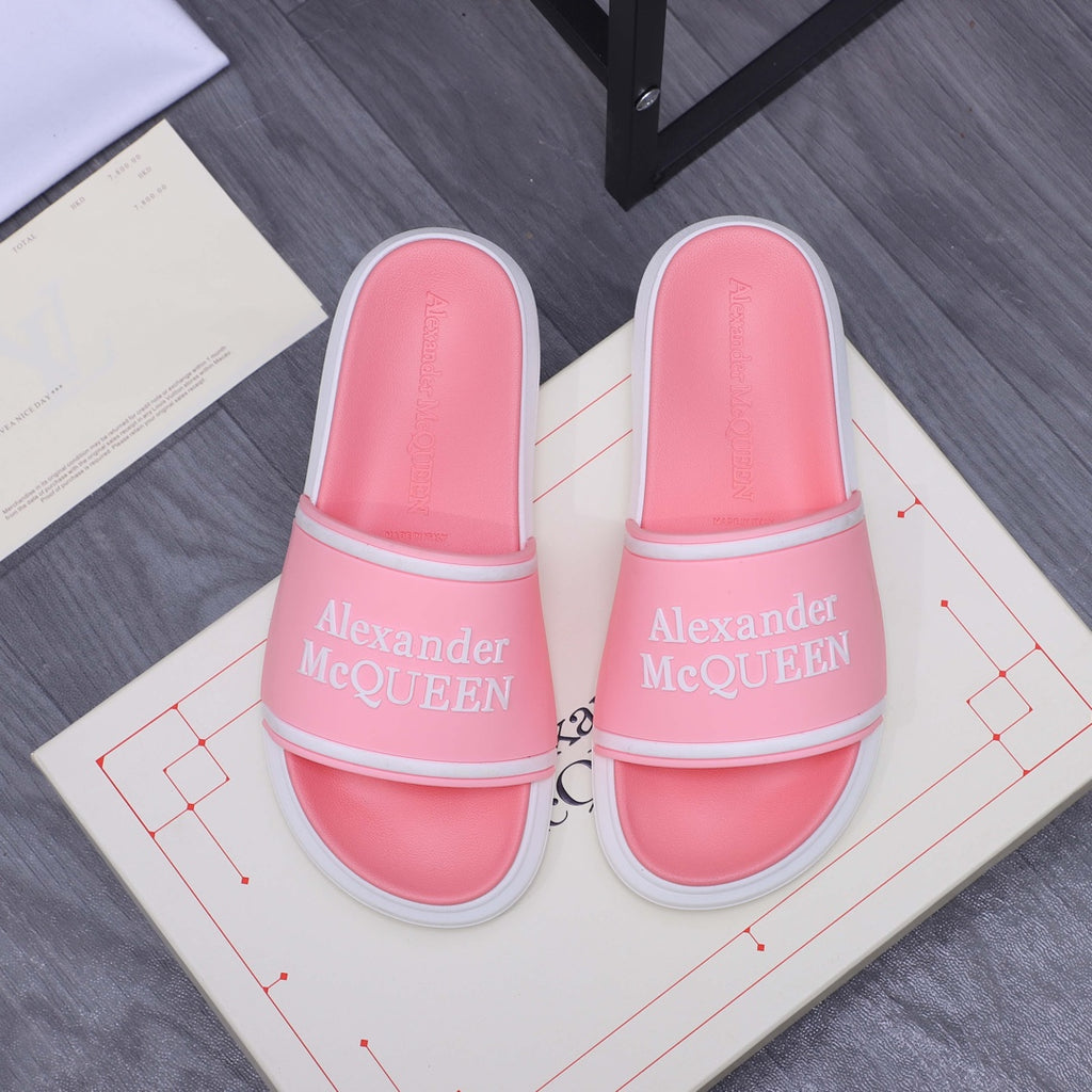 Pink slide sandals with wide strap and Alexander McQueen logo, white sole