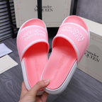 Pink slide sandals, inside view of footbed and lining, Alexander McQueen logo