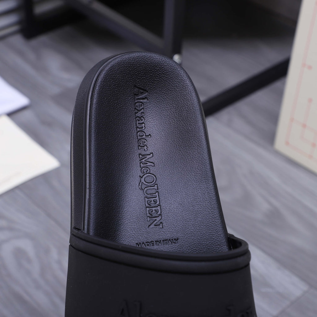 Alexander McQueen black slide sandal, embossed logo on footbed upper