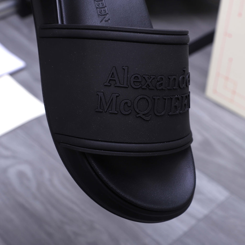 Alexander McQueen black slide strap with embossed logo lettering