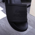 Alexander McQueen black slide strap with embossed logo lettering