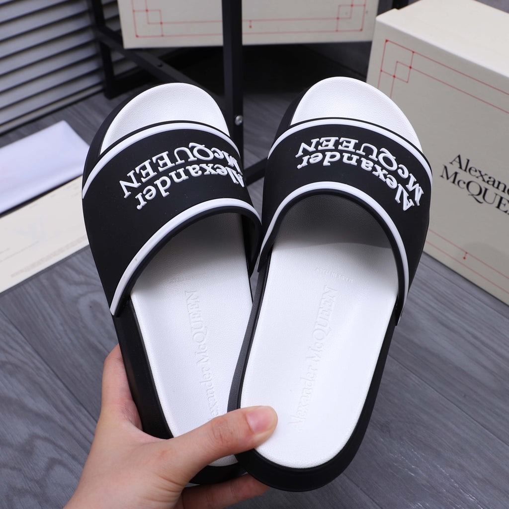Black slide sandals with Alexander McQueen logo print on inner footbed