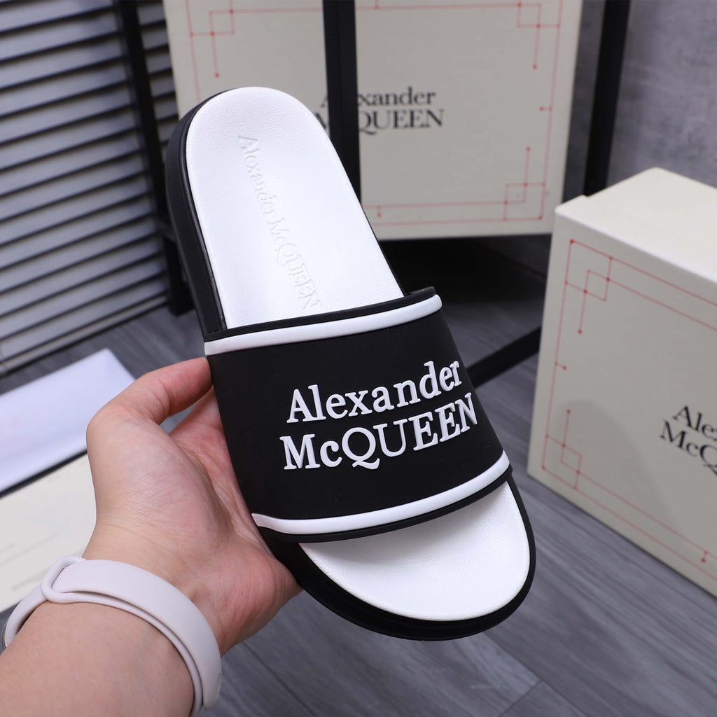 Textured white footbed and black slide strap with Alexander McQueen logo