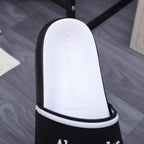 Textured white footbed with embossed text inside black slide sandal