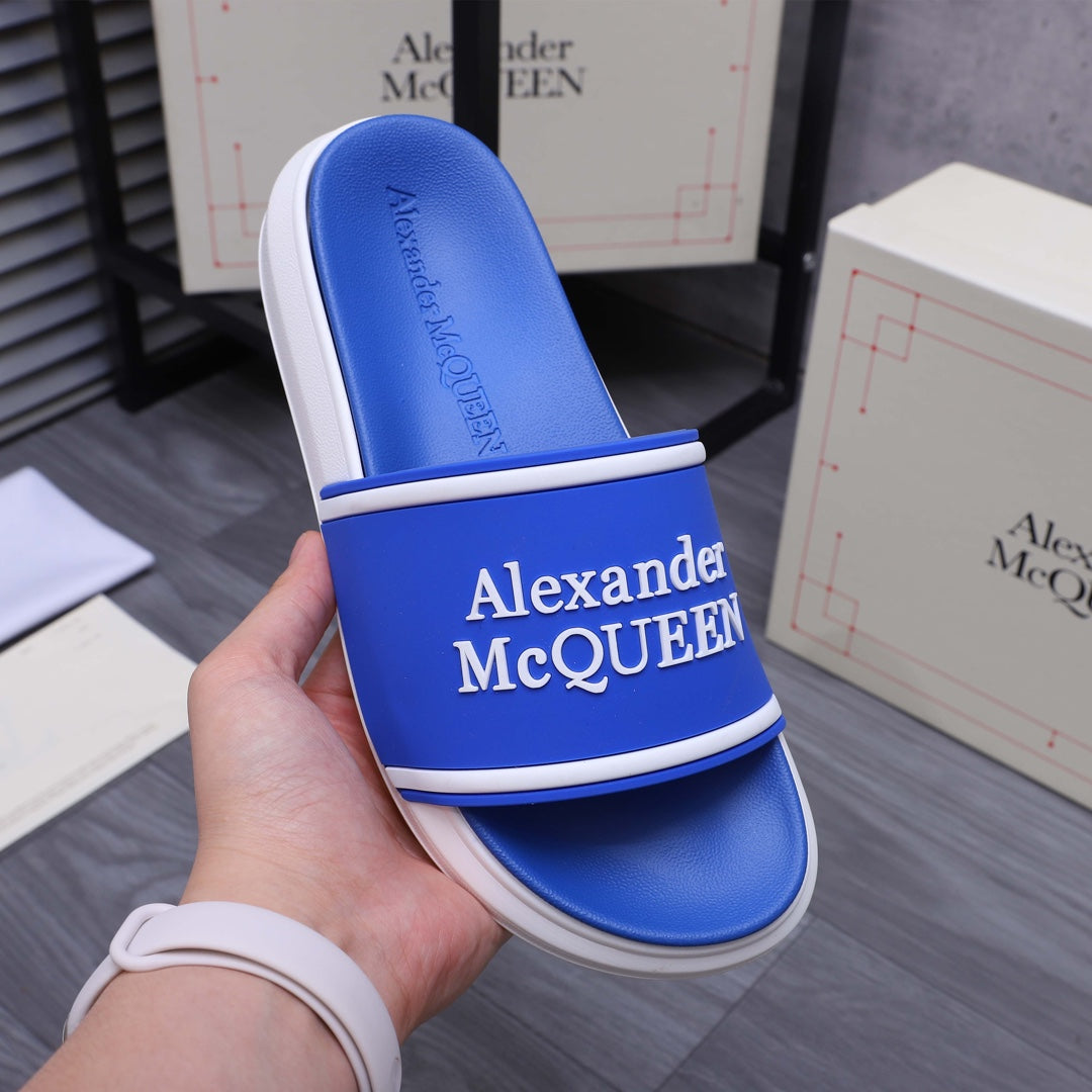 Blue slide sandal with white edge strap and Alexander McQUEEN logo panel