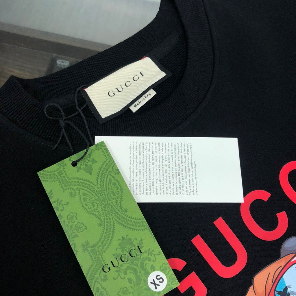 Black Gucci crewneck sweatshirt neckline with hang tags