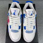 Pair of white lace-up sneakers with blue mesh quarters and Jumpman tongue patches.