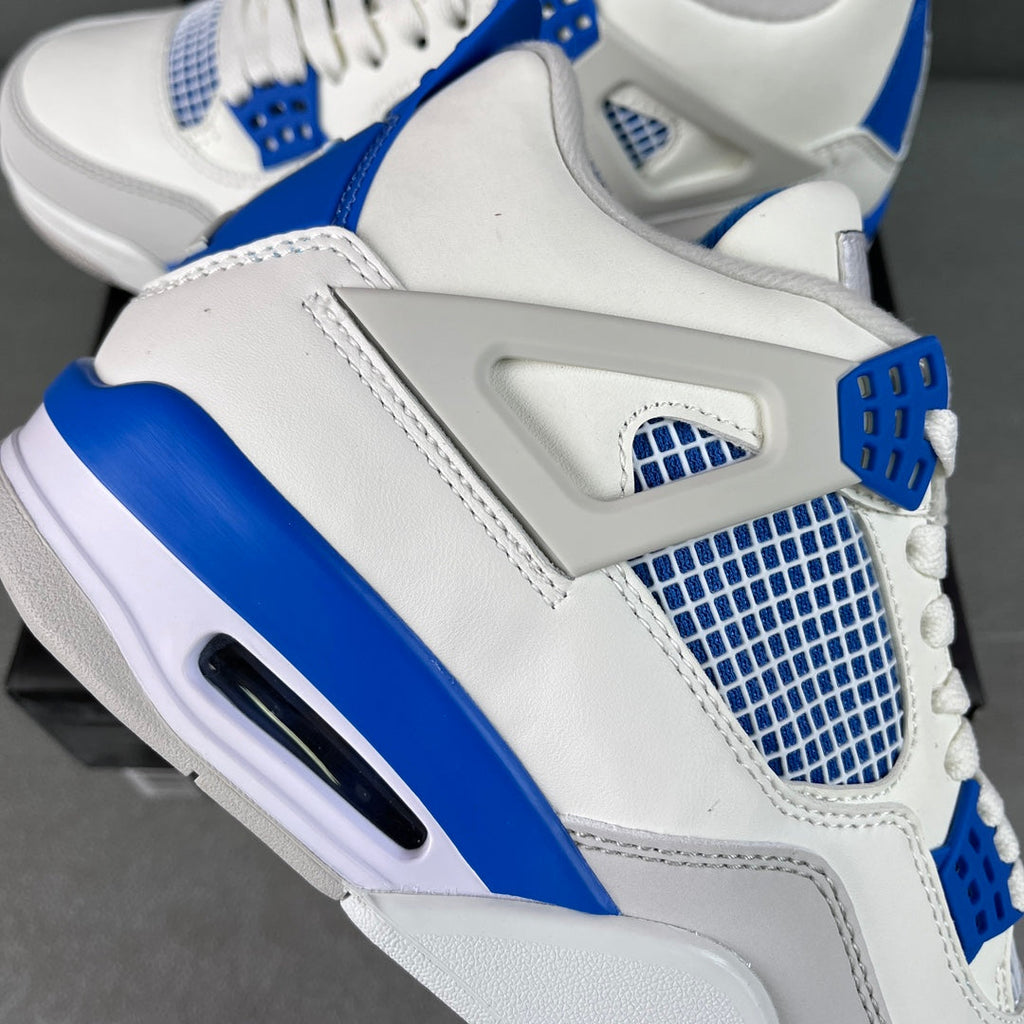 White sneaker with blue grid mesh overlay, gray trim, and side Air window.
