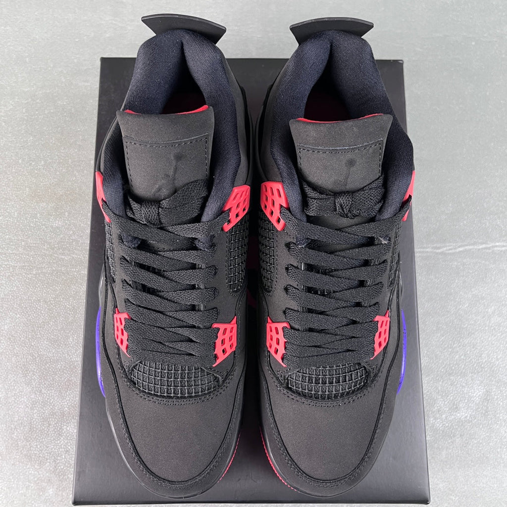 Black Air Jordan 4 sneakers front view with red and purple branding details