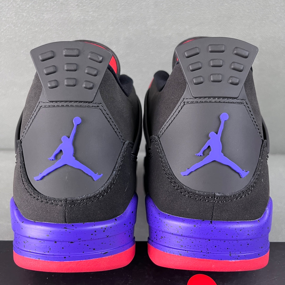Air Jordan 4 sneakers back view with purple midsole and red-accent heel tabs