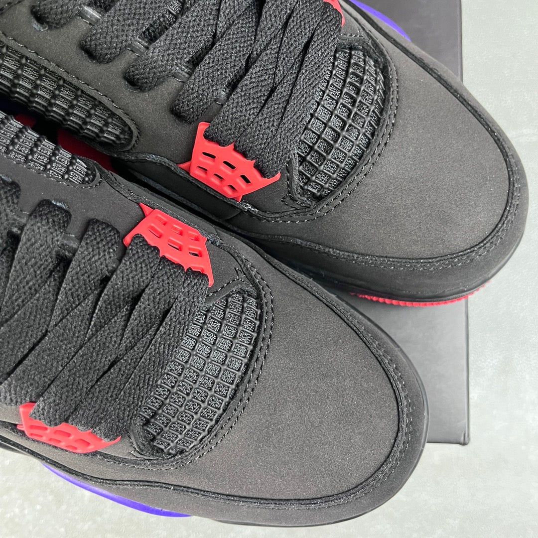 Pair of black Air Jordan 4 sneakers with textured net panels and red accent tabs