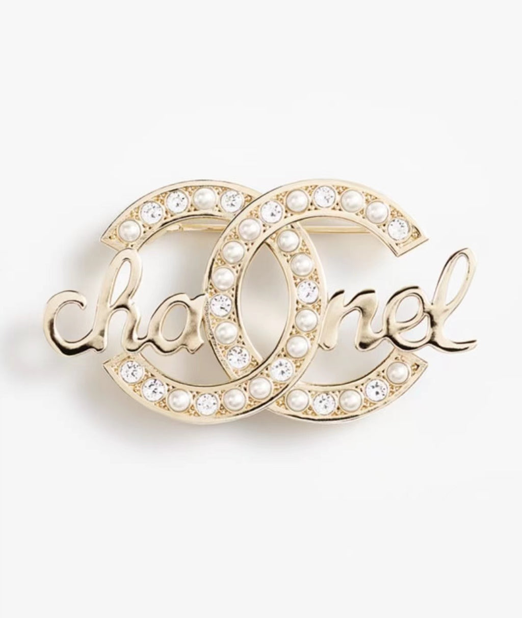 Gold-tone Chanel brooch with pearl-like stones and crystals, large O logo