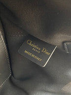 Black leather Dior tag reading 'Christian Dior Paris' and 'Made in Italy'