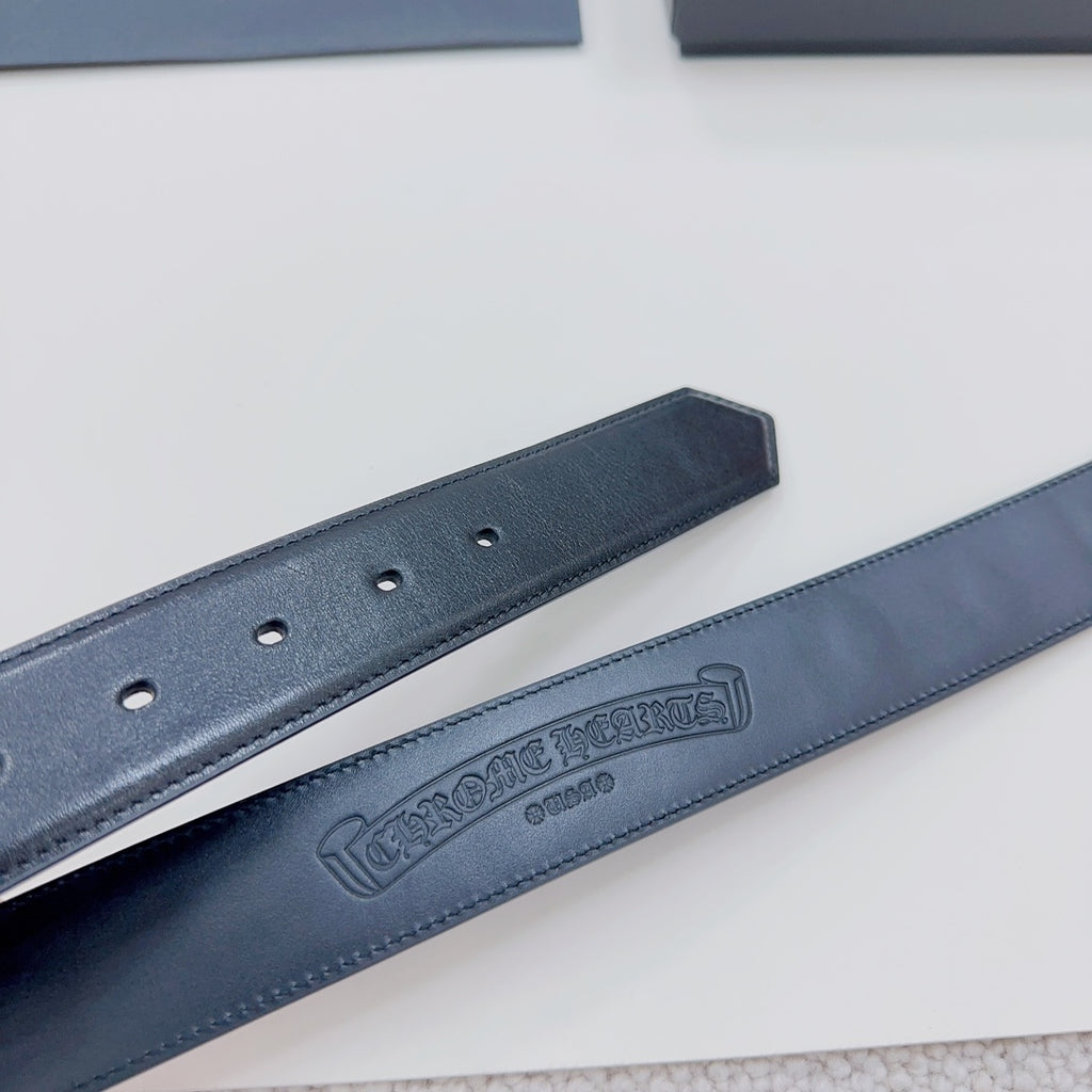 Chrome belt branding and holes: dark blue leather strap with embossed logo near center