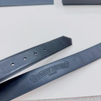 Chrome belt branding and holes: dark blue leather strap with embossed logo near center
