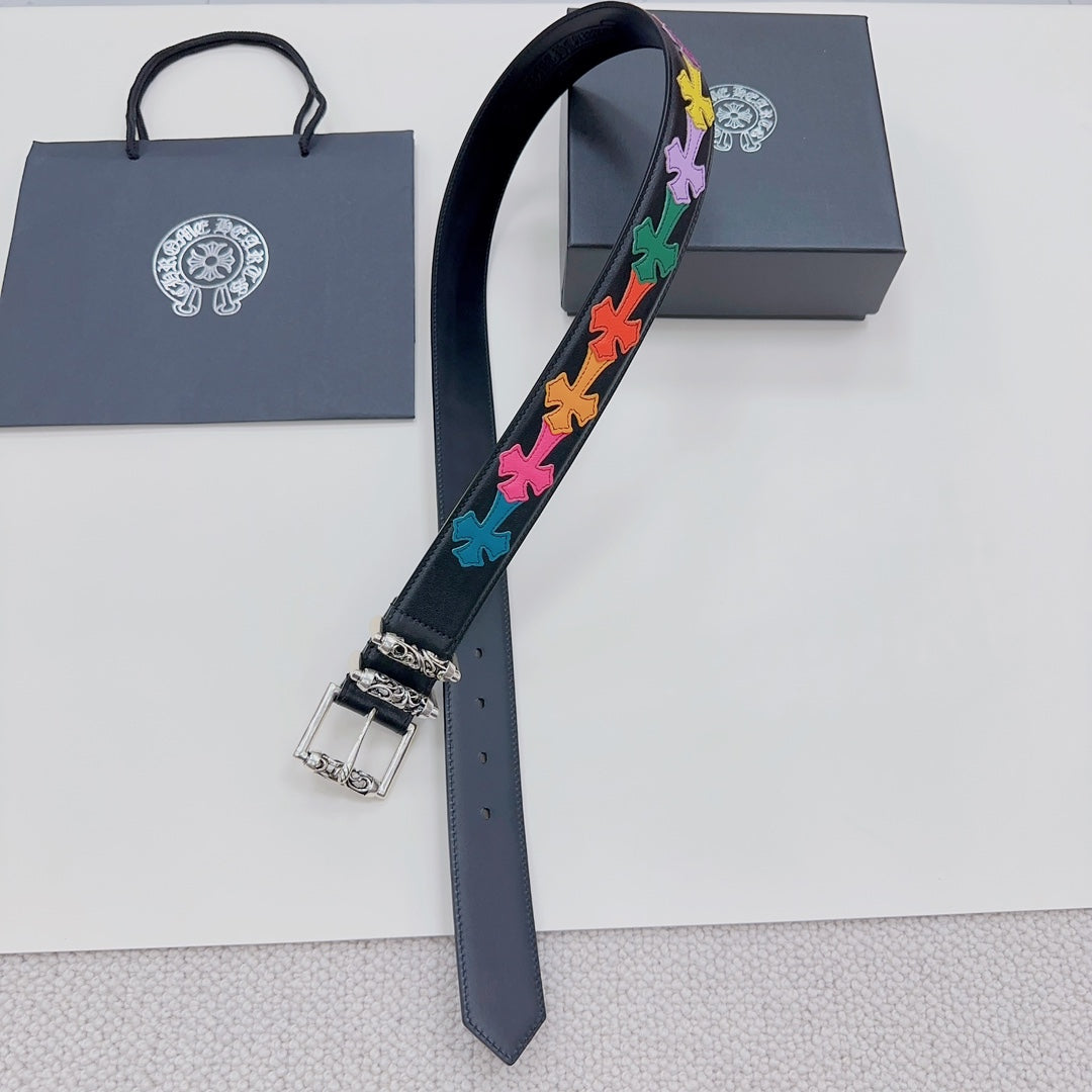 Chrome belt with dark blue strap, rainbow star appliques, silver buckle and chain detail