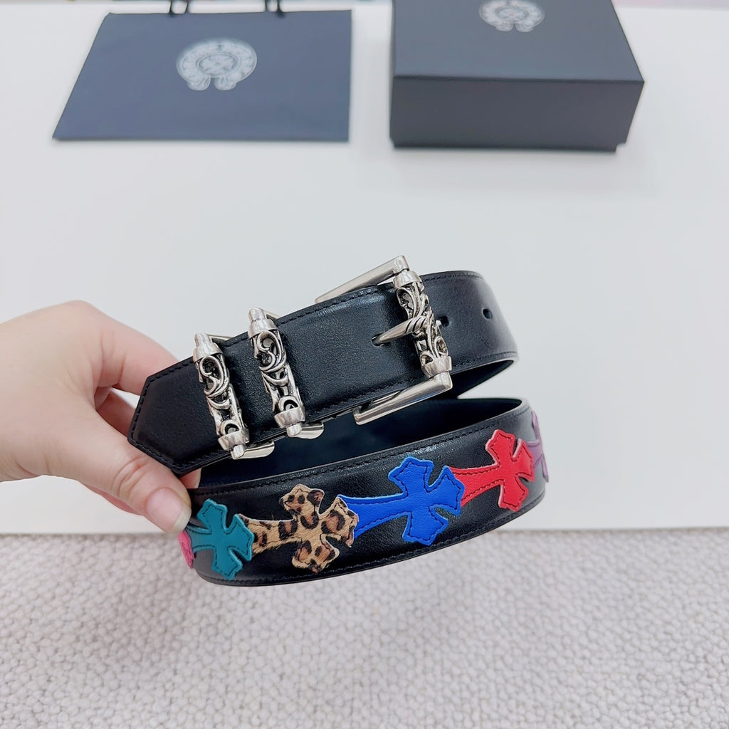 Chrome belt detail: dark blue leather with colorful star band and ornate silver clasp hardware