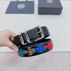 Chrome belt detail: dark blue leather with colorful star band and ornate silver clasp hardware
