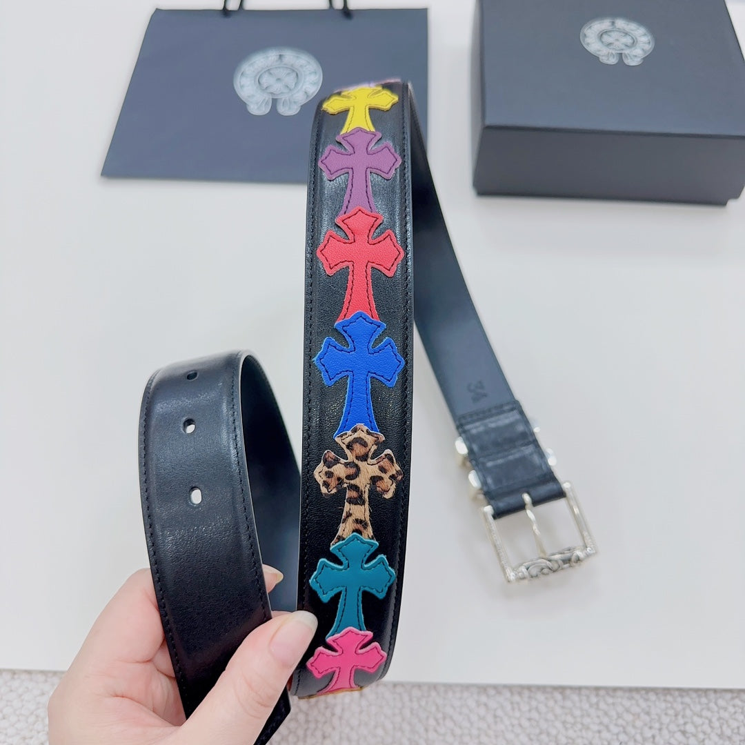 Chrome belt close-up: dark blue strap with rainbow star pattern and silver buckle ends