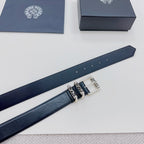 Dark leather belt strap with silver buckle hardware and etched accents, close-up
