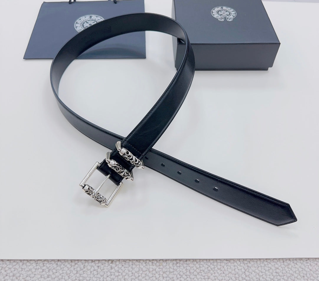 Dark leather belt with silver buckle, adjustable holes, strap end shown