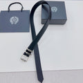 Dark leather belt with silver buckle and ornate metal keeper detail
