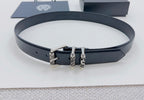 Dark leather belt with silver triple-prong buckle detail, laid flat