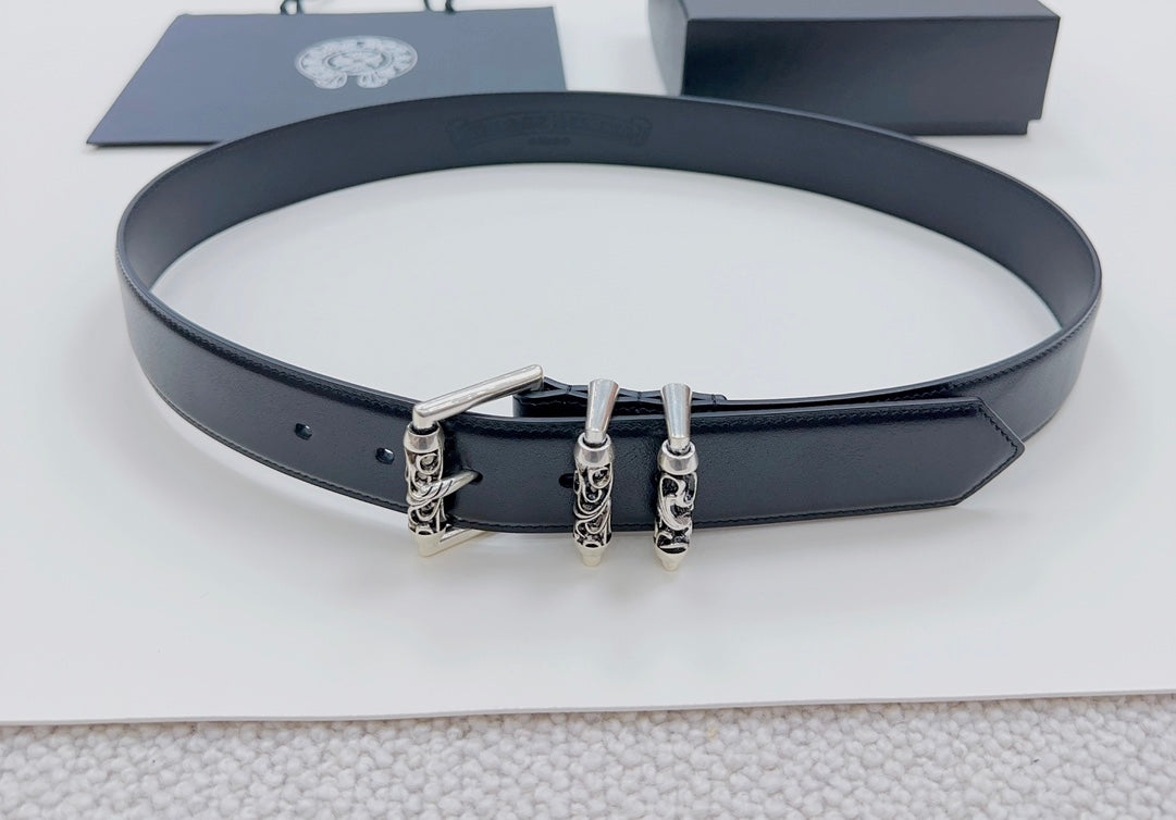 Dark leather belt with silver triple-prong buckle detail, laid flat