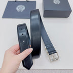 Dark leather belt with stitched edges and silver buckle backing, folded view