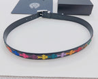 Dark blue belt with multicolor cross trim, arranged in a circular loop