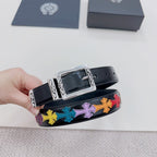 Dark blue belt detail with silver buckle and multicolor cross pattern near the holes