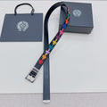 Dark blue belt with colorful cross pattern and silver rectangular buckle