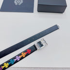 Dark blue belt with multicolor cross trim and silver buckle close-up
