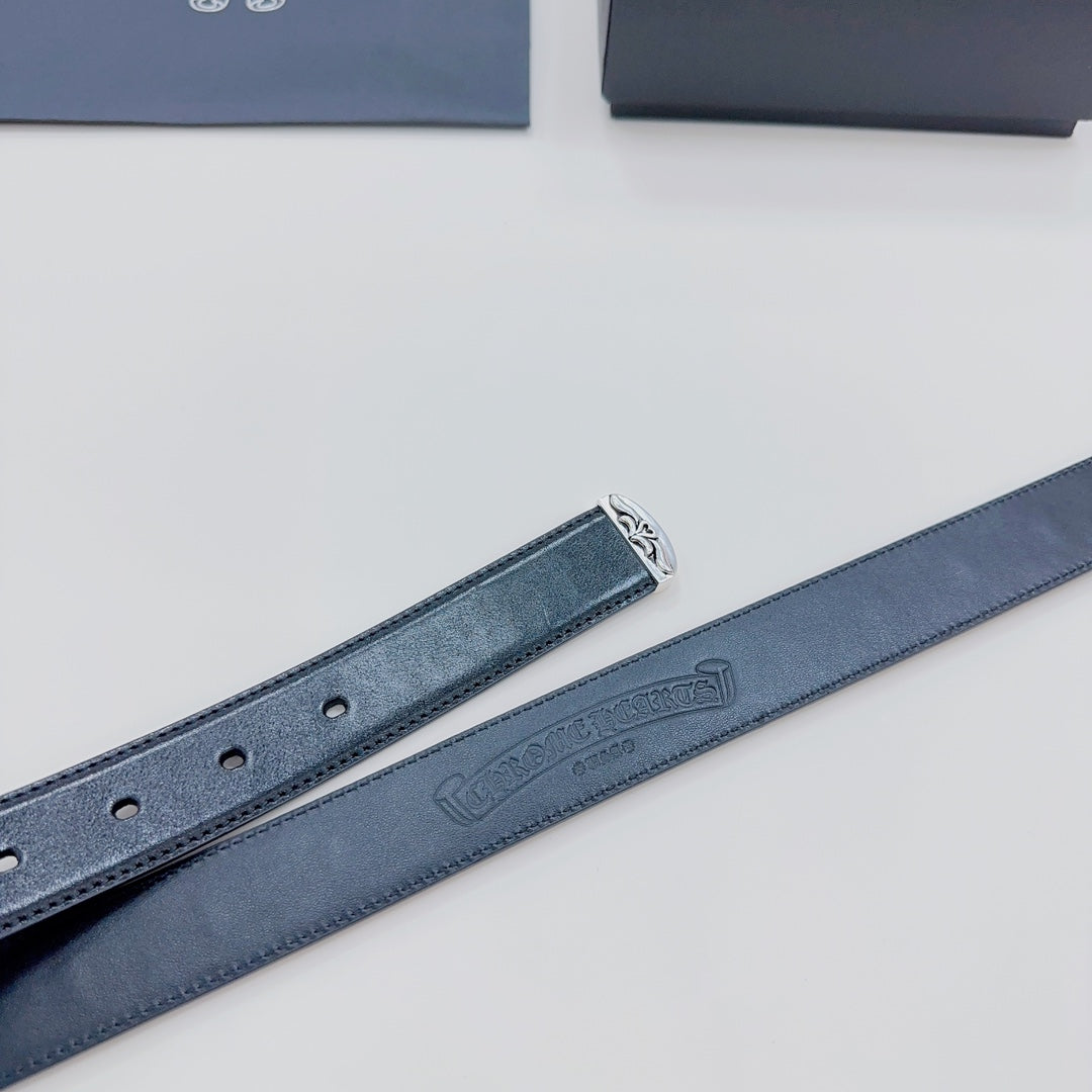 Dark blue belt strap with perforation holes and embossed logo on the inside
