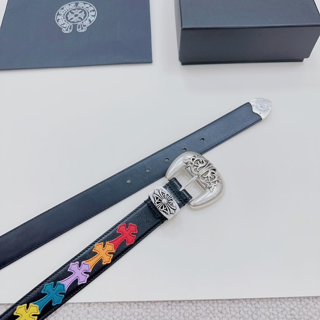 Dark blue leather belt detail with silver buckle and multicolor cross-pattern strip on strap.