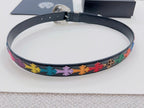 Round-belt view: dark blue leather with multicolor cross pattern along the strap edge.