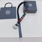 Dark blue leather belt with silver oval buckle and multicolor cross-pattern strap.
