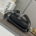 Black top-handle bag with jacquard strap, silver hardware, and front emblem.