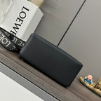 Black leather rectangular clutch bag with smooth front and stitched edges.