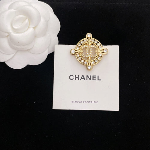 Gold-tone rhinestone Chanel brooch, circular medallion and cross arms