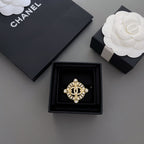 Gold-tone rhinestone Chanel brooch in black display box
