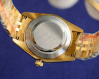 Rolex watch case and bracelet end with gold-tone bezel and clasp