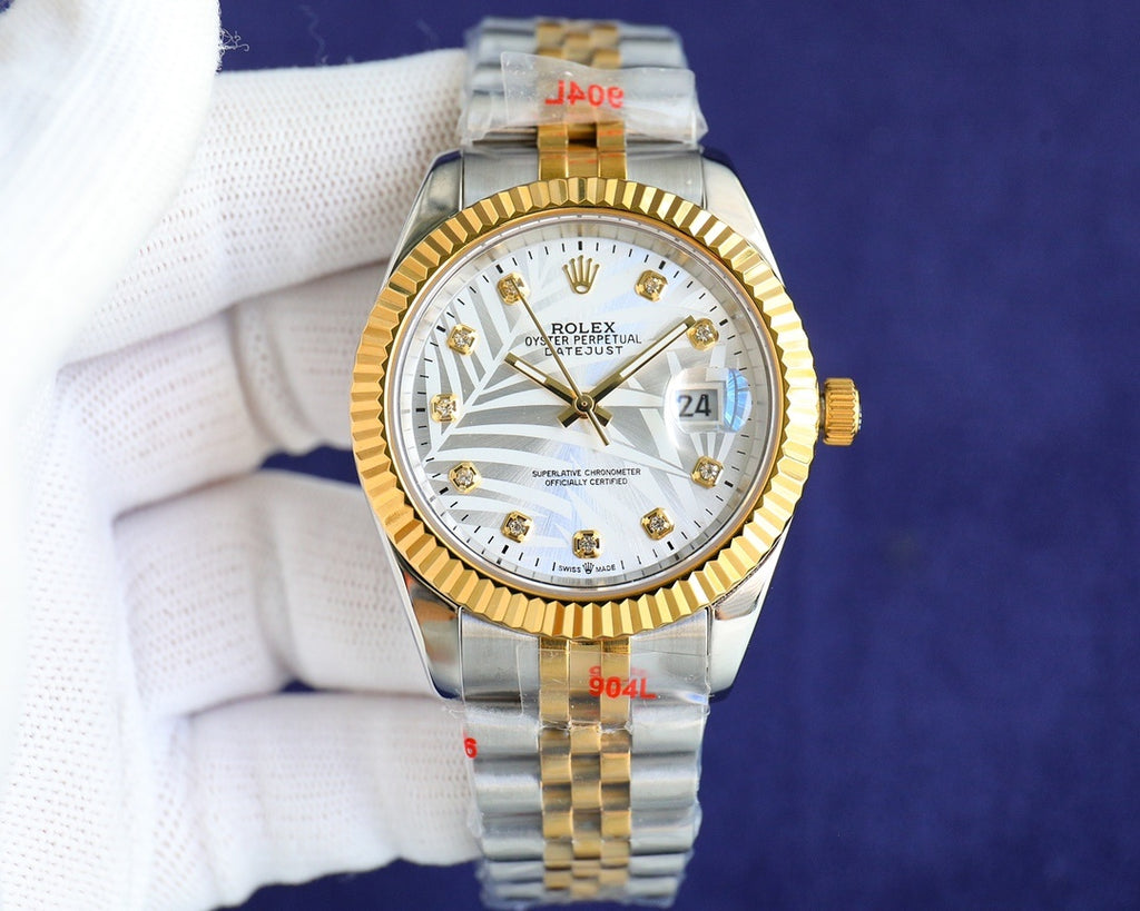 Rolex watch with white dial, gold bezel and two-tone metal bracelet