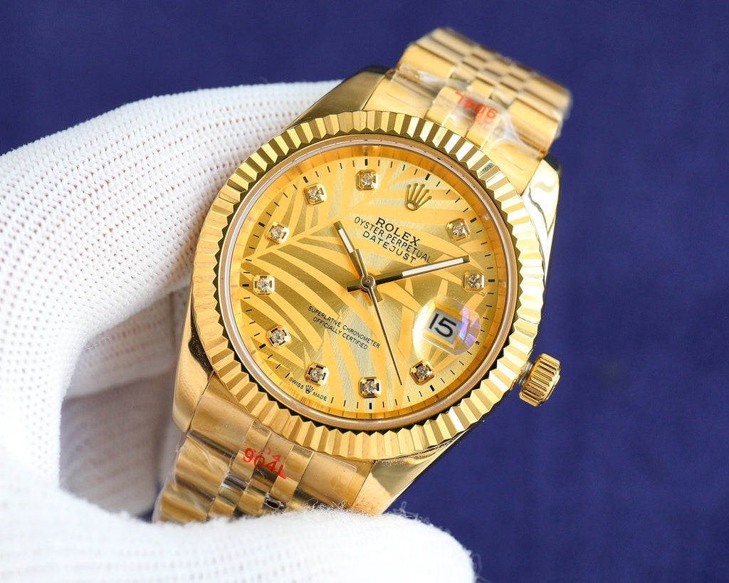 Rolex watch with gold-toned dial, gold-tone metal bracelet, and date window at 15