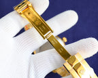 Rolex watch bracelet with gold-tone clasp and engraved underside