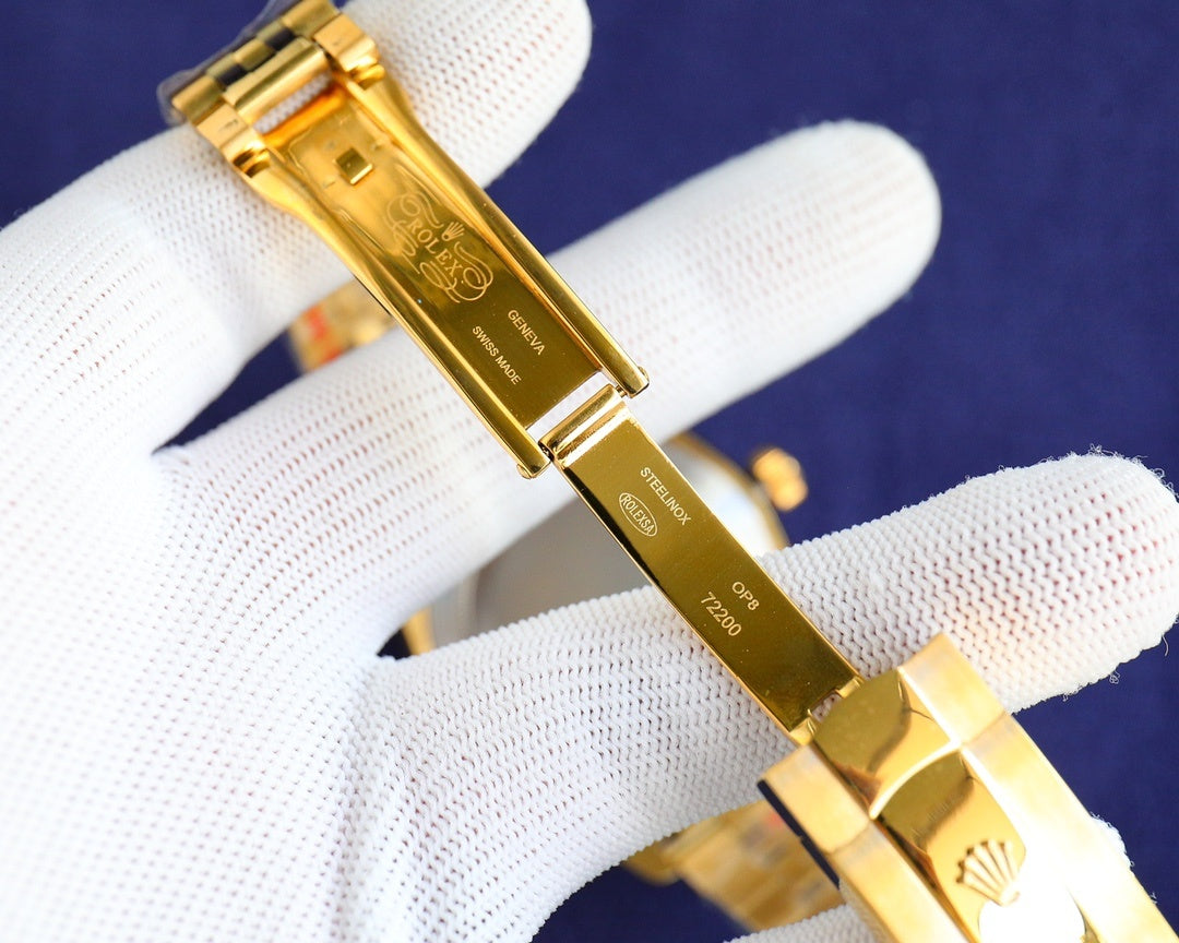 Rolex watch bracelet with gold-tone clasp and engraved underside