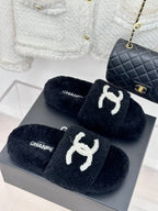 Women's dark navy CHANEL teddy slides with white embroidered CC logo