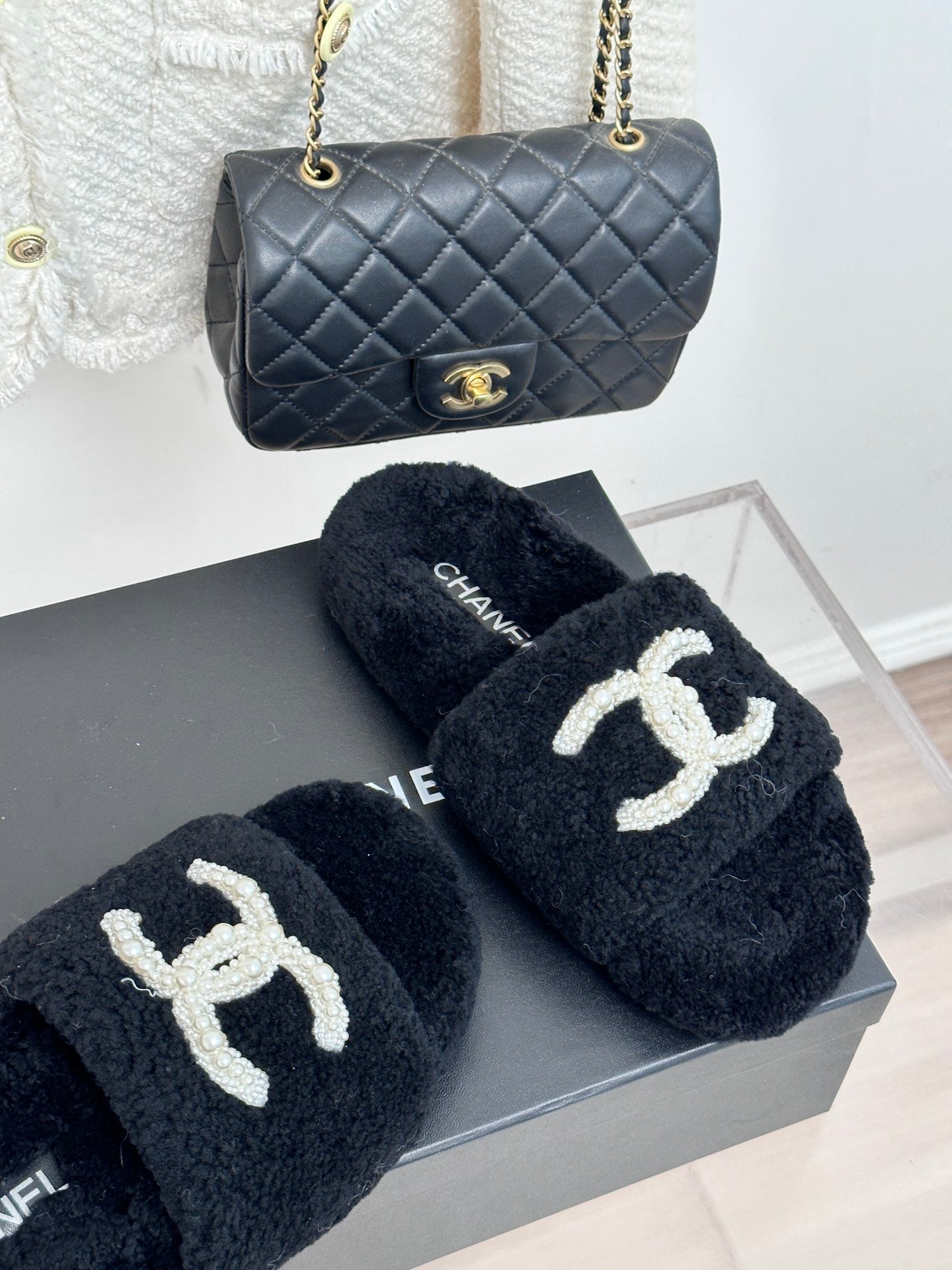 Women's dark navy CHANEL teddy slides on box, white CC logo