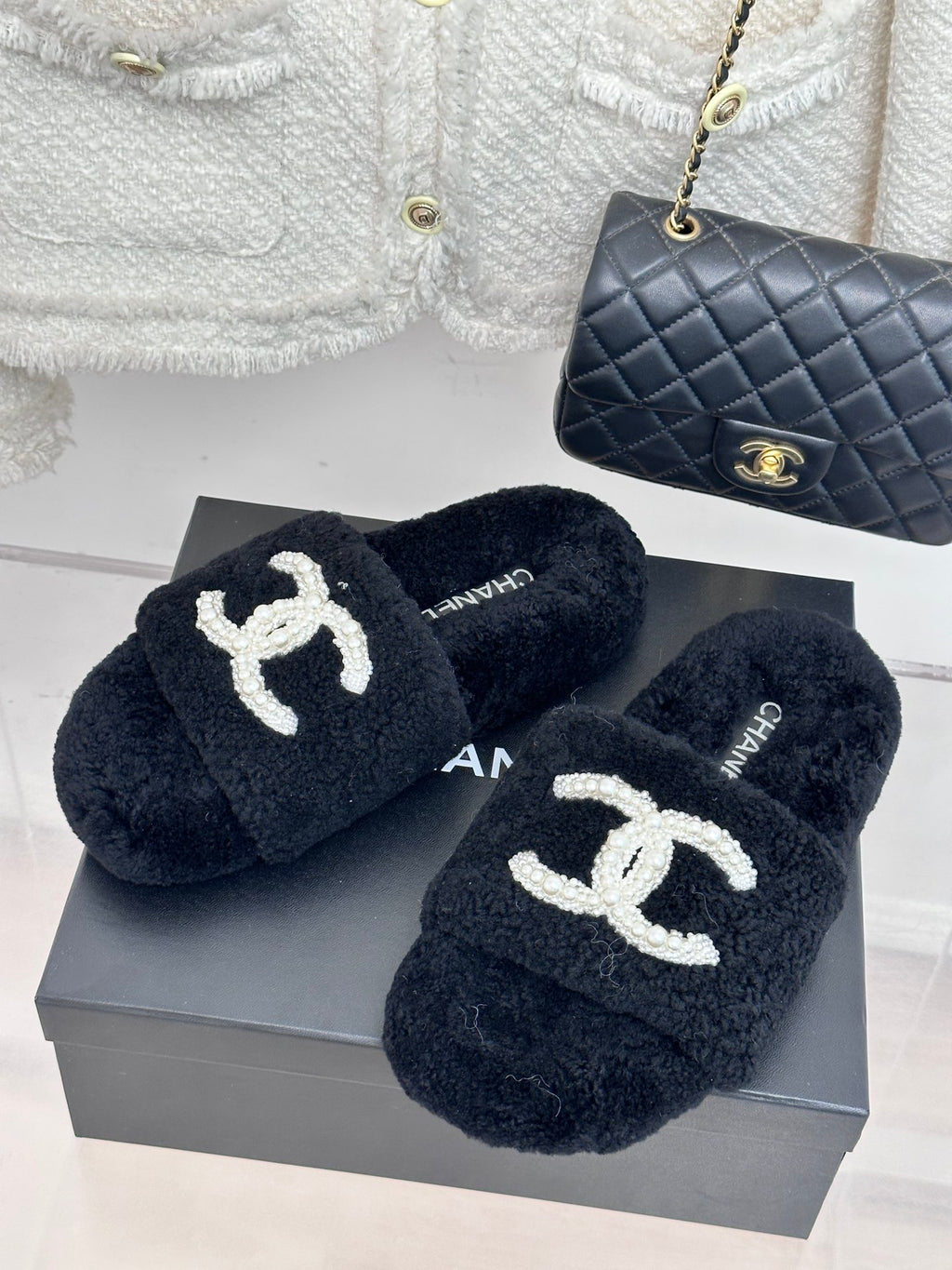 Women's dark navy CHANEL plush slides with white pearl CC logo